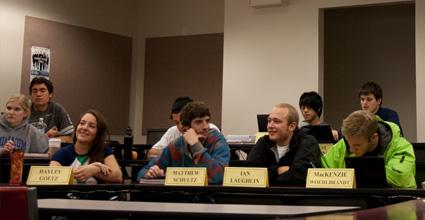 A group of students attending class, with nametags 