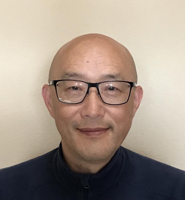 Dr. Xiofeng Chen wearing a dark shirt.