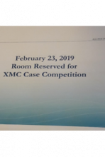 Sign reading, "February 23, 2019 - Room Reserved for XMC Case Competition"