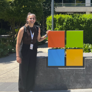 Student intern in front of Microsoft sign